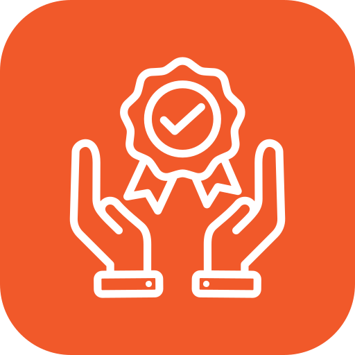 achievement - Three Rocks Pavers, Inc. Two hands grasping a checkmark badge, symbolizing quality assurance, on an orange background.